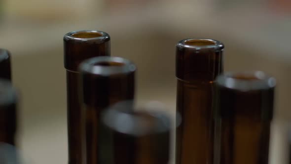 Empty Wine Bottles Being Taken Off the Conveyor