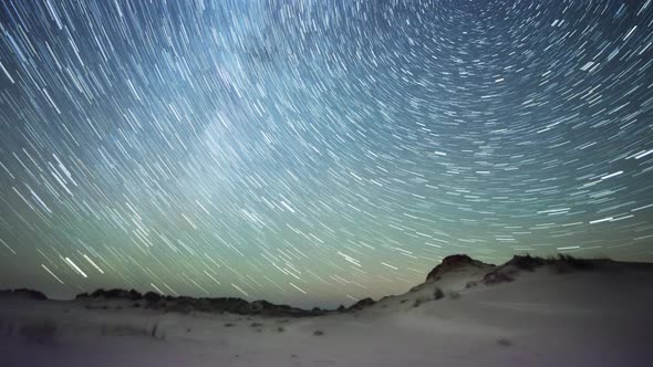 Milky Way star trails over embryonic dunes timelapse