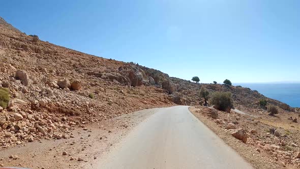 Zig-zag curve road and U-turns in a desert canyon.