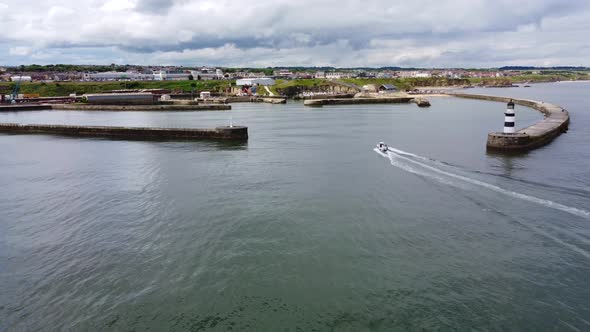 Aerial Drone Shot Reversing Upwards Over Seaham Harbour and Lighthouse