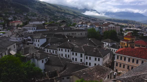 fly over upon well-preserved Ottoman architecture in Gjirokaster old town, Albania.