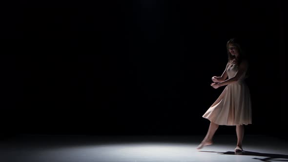 Talanted Woman Dancer Dancing Contemporary Dance Moves and Somersault, on Black, Shadow