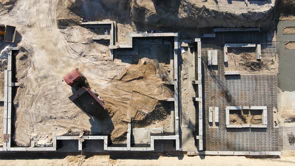 Large Construction Of A Residential Complex. The Truck Pours Sand. 