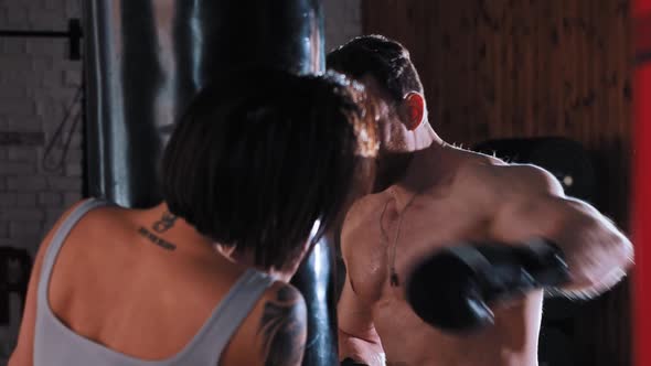 Boxing Training in the Gym Man Boxer Training His Punches with His Female Trainer Holding the