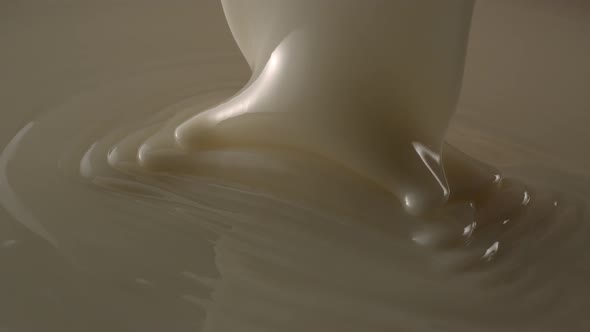 White Chocolate Pouring Down In Slow Motion Tabletop 4k