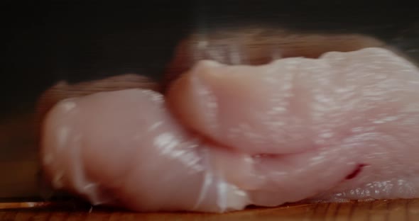 Raw Chicken Fillet Is Cut Into Pieces. 