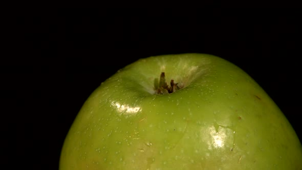 Top of Green Apple Isolated on Black, Rotation