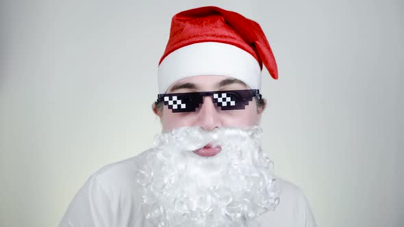 Dancing Swag Santa Claus in Funny Pixelated Sunglasses on White Background