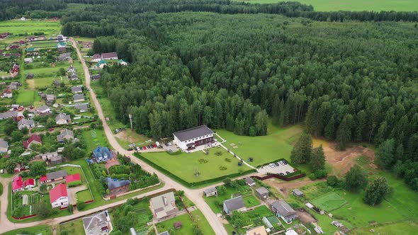 Top View of the Wedding Venue in a Green Field and a House in the Village Near the Forest. Wedding