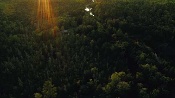 Aerial shot over Piscataquis River at Barrel Falls.