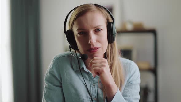 Woman in Headset Having Conference