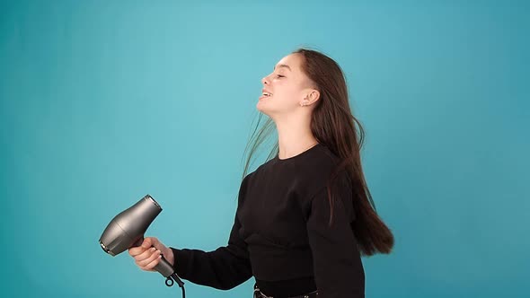 Lady Brunette Sings Into Hairdryer