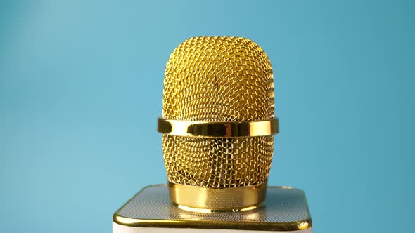 Gold microphone rotate on table