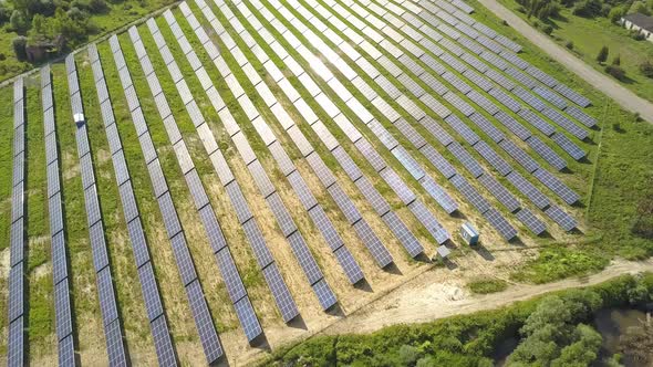 Aerial view of solar power plant field. Electrical photovoltaic panels for producing clean ecologic 