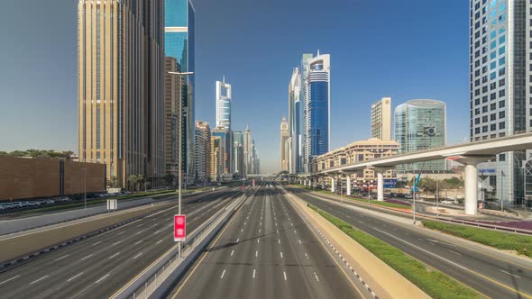 Busy Sheikh Zayed Road Timelapse Metro Railway and Modern Skyscrapers Around in Luxury Dubai City