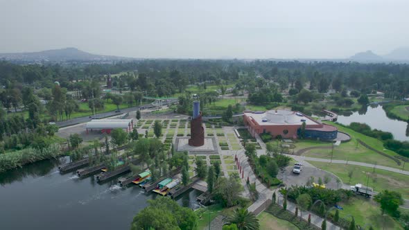 Orbital footage with view of a lake, a highway and a natural area in Mexico City