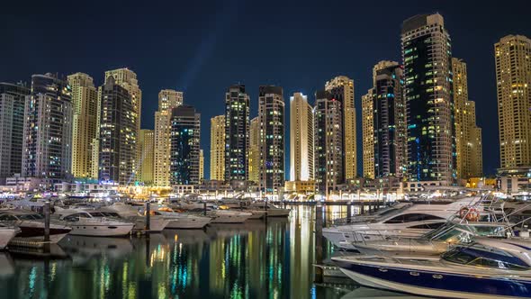 View of Dubai Marina Towers and Yahct in Dubai at Night Timelapse Hyperlapse