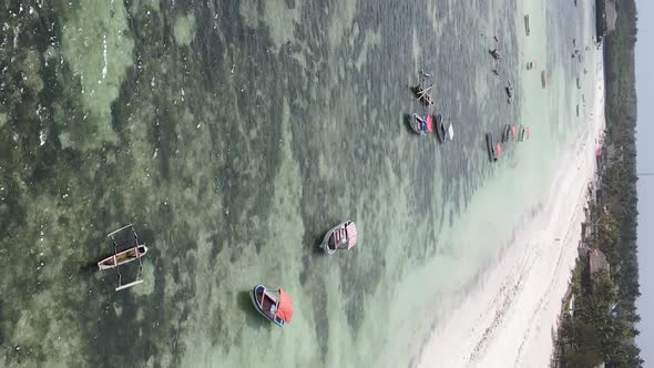 Tanzania Vertical Video  Boat Boats in the Ocean Near the Coast of Zanzibar Aerial View