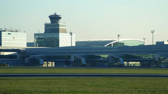 Modern Airport Building with Control Tower - Airplanes