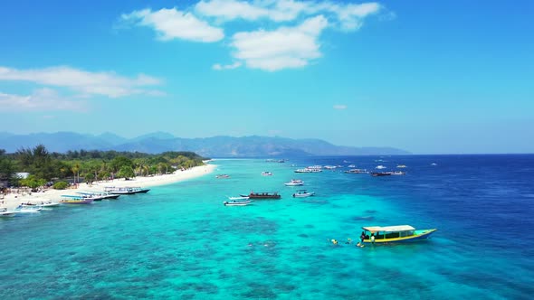 Aerial drone scenery of marine coastline beach lifestyle by blue sea with white sandy background of 