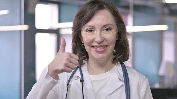 Portrait of Successful Middle Aged Professional Doctor Looking and Doing Thumbs Up
