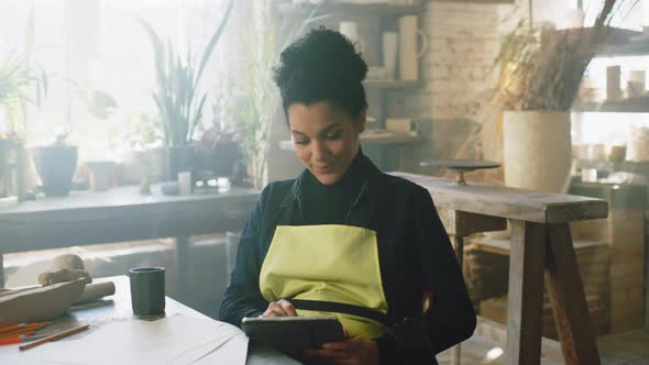 Woman Has Coffee Break at Work