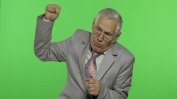 Elderly Businessman in Suit Something Emotionally Tells and Laughing. Chroma Key