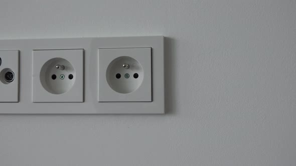 Electric Outlets on a White Wall - Closeup