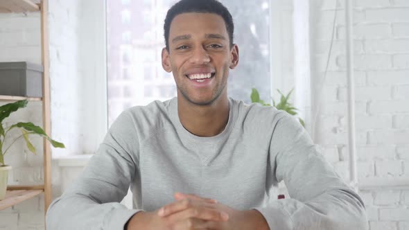 Portrait of Smiling AfroAmerican Man Looking at Camera in Office