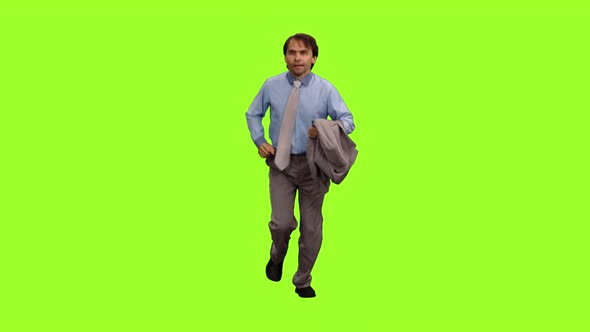 Business Man with Suit Jacket in Hand Runs on Green Background