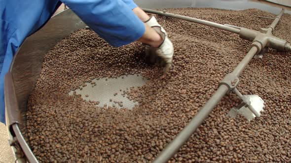 Slow Motion of Mans Hands Mixing Coffee Beans