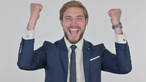 Successful Young Businessman Celebrating on White Background