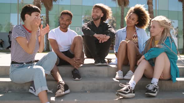 Cool Young Diverse Friends Chilling on Street