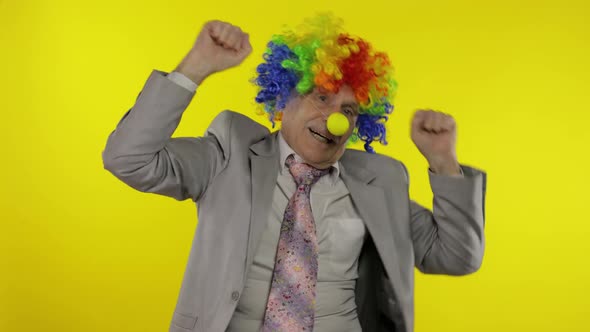 Elderly Clown Businessman Entrepreneur Boss Dancing, Entertains, Celebrate