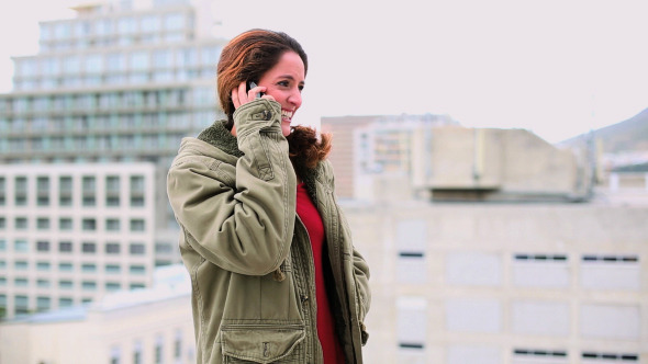 Pleased Brunette Woman Making A Phone Call