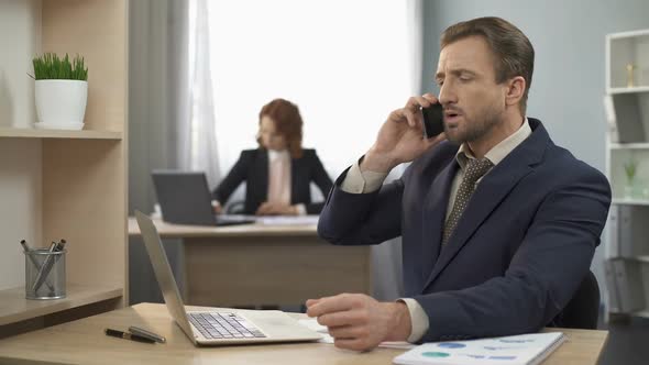 Businessman Talking Over Mobile Phone With Client, Appointing Meeting, Deal