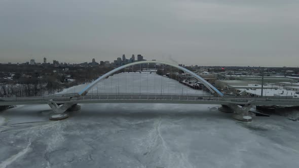 Lowry Avenue bridge in north minneapolis during winter time aerial view, Mississipi river frozen