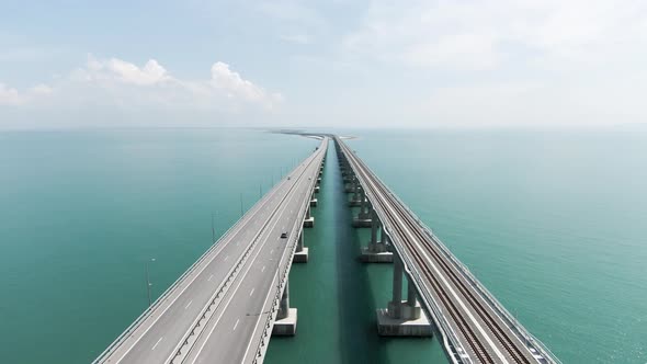 Aerial View Along the Long Beautiful Bridge Above Turquoise Sea