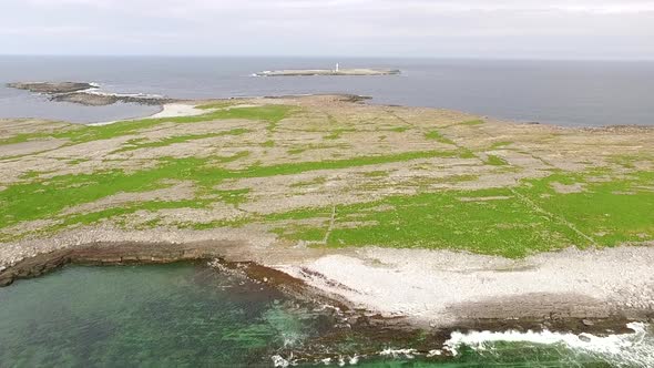 Bird flight to the lighthouse in aran islands, Inishmore