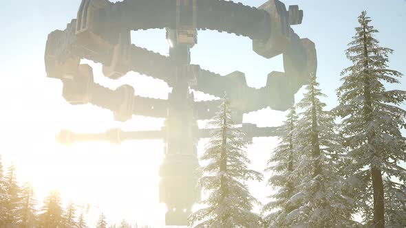 UFO Hovering Over a Forest at Sunset with Light Beam alt