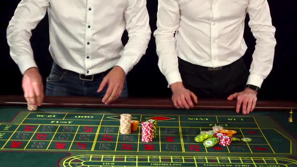 Young Cute Guys Dressed Formally Playing Roulette
