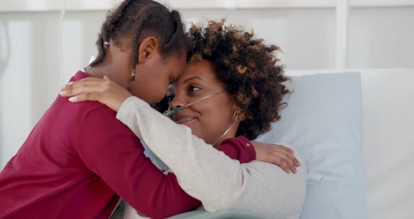 Cute African Daughter Visiting Sick Mother in Hospital and Hugging