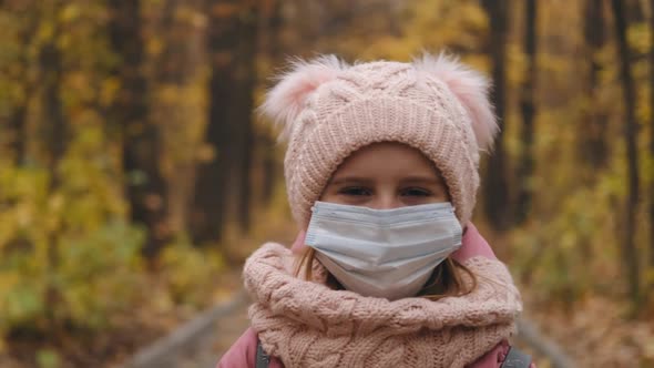 Portrait of Young Girl in Protective Mask