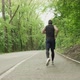 Young Male with Face Mask in Sportswear Running on the Road at Forest. Men Doing Intense Run Workout - VideoHive Item for Sale