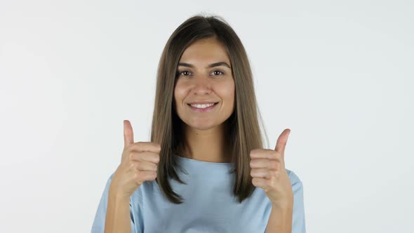 Thumbs Up by Beautiful Girl, White Background in Studio