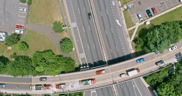 Aerial View on a Highway Running Through Small Town with Near Parking Lot