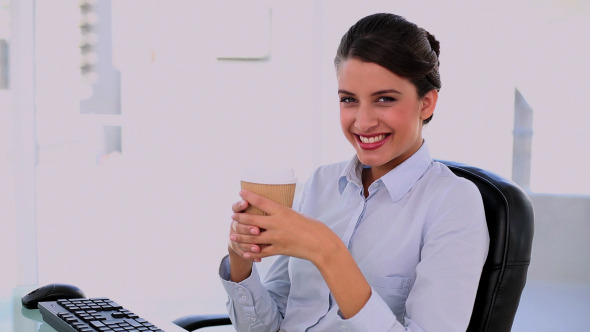 Peaceful Beautiful Businesswoman Enjoying Coffee