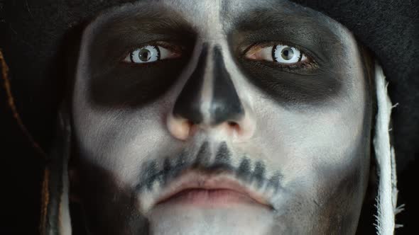 Close-up of Scary Man Face in Carnival Skull Halloween Makeup of Skeleton Looking Creepy at Camera