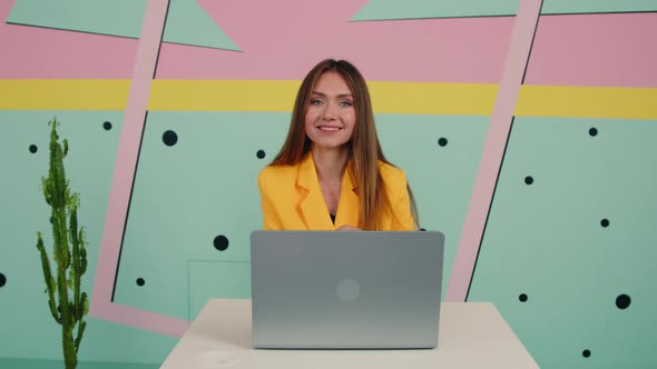 Portrait of Young Brunette Woman In Yellow Jacket