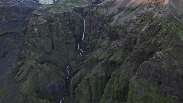 Drone Flight From Waterfall In Majestic Mountainous Landscape
